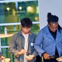 International Anchor Allies Winter 2026 First Mixer - Student dishing some their meals